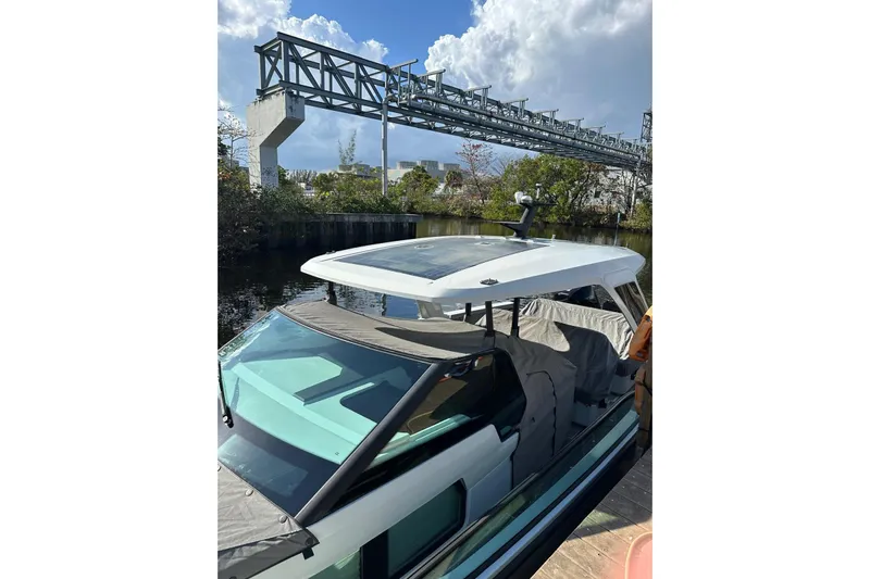 La Flare Yacht Photos Pics 2023 Saxdor 320 GTO boat docked under a clear sky.