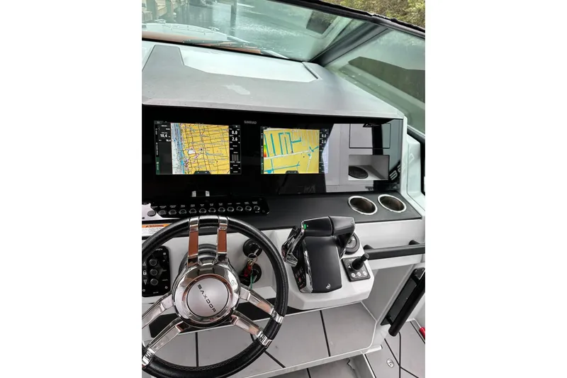 La Flare Yacht Photos Pics Helm of 2023 Saxdor 320 GTO with navigation screens and steering wheel.