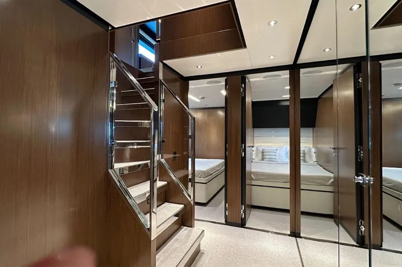  Yacht Photos Pics Luxurious interior of 2024 Riva 102' Corsaro Super yacht with elegant wood finishes.