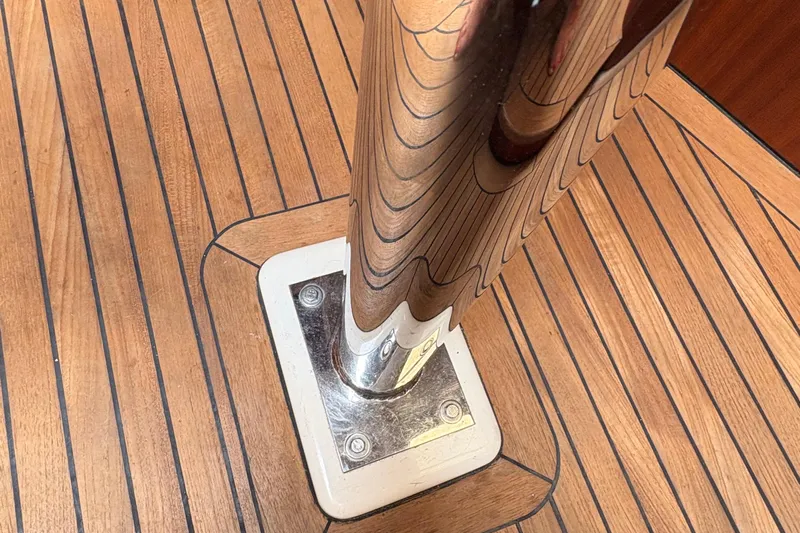 Arethusa Yacht Photos Pics Polished metal post on teak deck of 2017 Leonardo Eagle 44 yacht.
