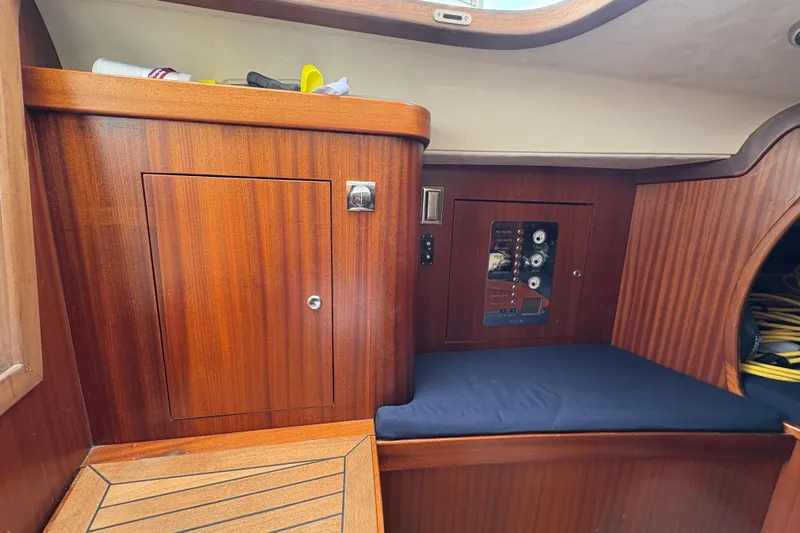 Arethusa Yacht Photos Pics Interior of 2017 Leonardo Eagle 44 yacht with wooden cabinetry and control panel.