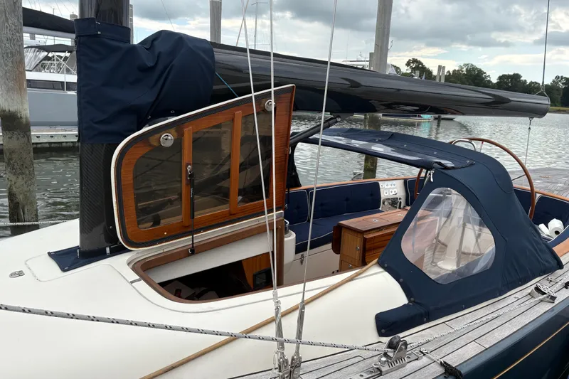 Arethusa Yacht Photos Pics Sailboat Leonardo Eagle 44, 2017 model, docked with wooden cabin and blue canopy.