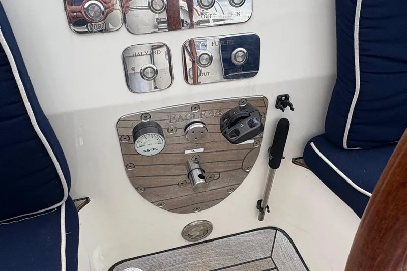 Arethusa Yacht Photos Pics Control panel of 2017 Leonardo Eagle 44 yacht with blue cushioned seating.