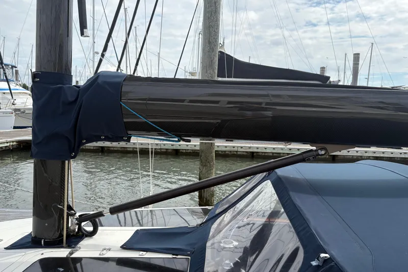 Arethusa Yacht Photos Pics Sailboat mast and boom of 2017 Leonardo Eagle 44 at marina dock.