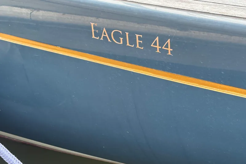 Arethusa Yacht Photos Pics Blue hull of 2017 Leonardo Eagle 44 sailboat with gold lettering.