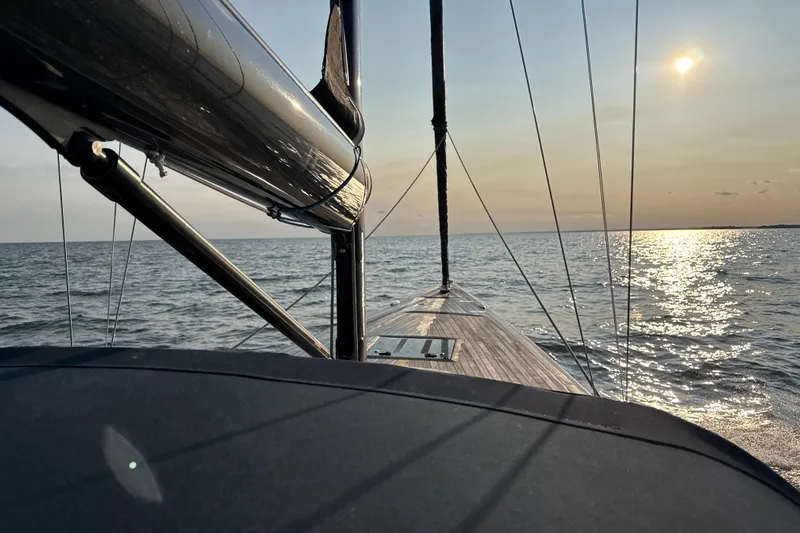 Arethusa Yacht Photos Pics Sailing on Leonardo Eagle 44 yacht at sunset, 2017 model, serene ocean view.