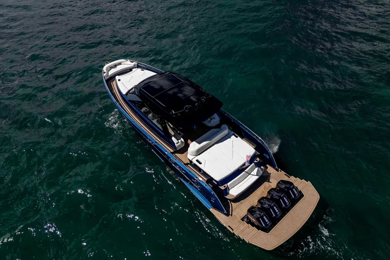  Yacht Photos Pics Aerial view of 2025 Dutch American DA 53 luxury boat on open water.