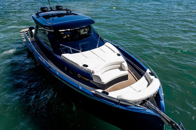  Yacht Photos Pics Luxurious 2025 Dutch American DA 53 yacht cruising on clear blue waters.