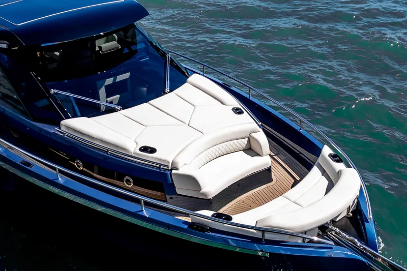  Yacht Photos Pics Luxurious 2025 Dutch American DA 53 yacht with elegant white seating on blue waters.