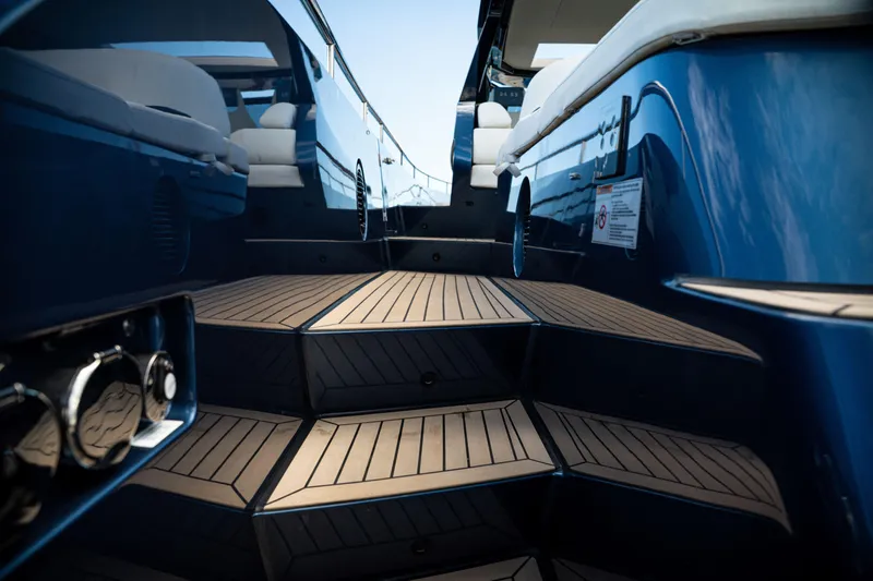  Yacht Photos Pics 2025 Dutch American DA 53 yacht with sleek blue exterior and wooden steps.