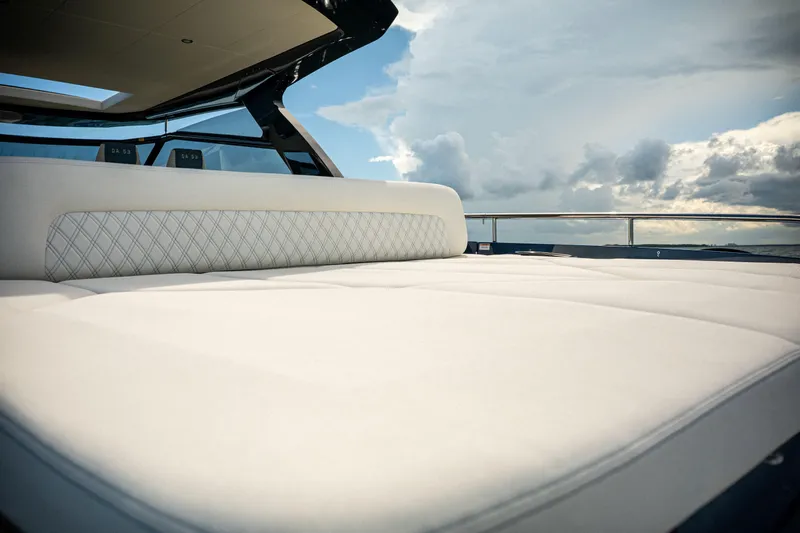  Yacht Photos Pics Luxurious Dutch American DA 53 yacht interior with plush seating, 2025 model, under a cloudy sky.
