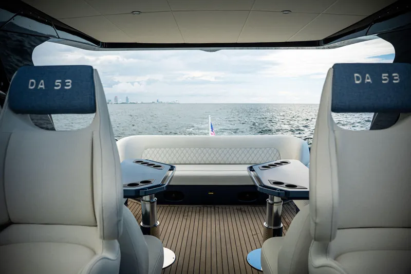  Yacht Photos Pics Luxurious 2025 Dutch American DA 53 yacht interior with ocean view and elegant seating.