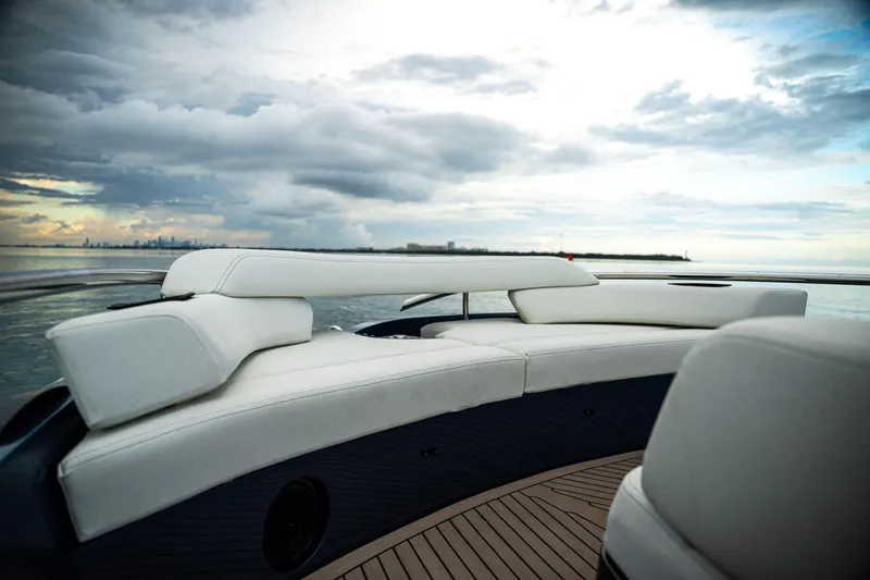  Yacht Photos Pics Luxurious seating on 2025 Dutch American DA 53 yacht, with ocean view and cloudy sky.