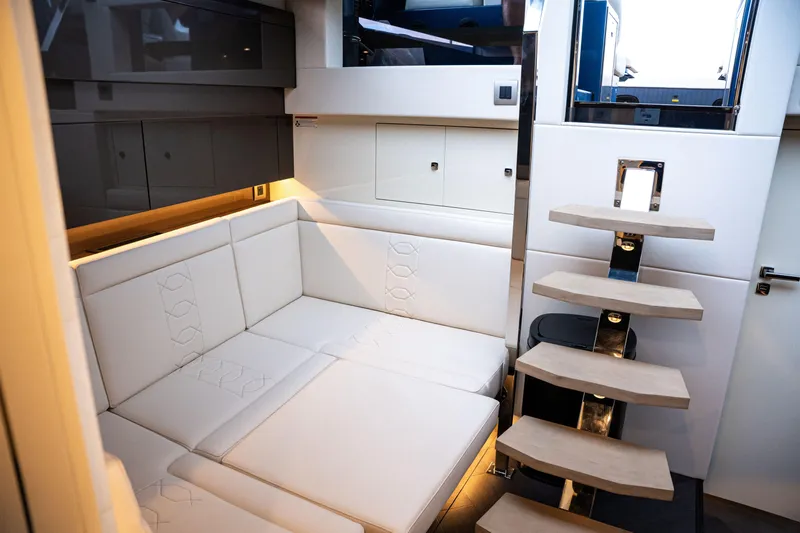  Yacht Photos Pics Luxurious interior of 2025 Dutch American DA 53 yacht with modern seating and sleek staircase.