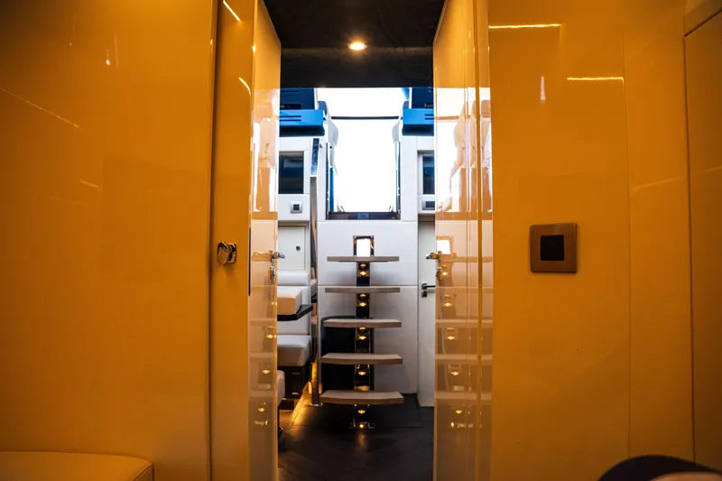  Yacht Photos Pics Luxurious interior of 2025 Dutch American DA 53 yacht with modern staircase and lighting.