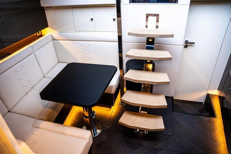  Yacht Photos Pics Luxurious interior of 2025 Dutch American DA 53 yacht with modern seating and staircase.