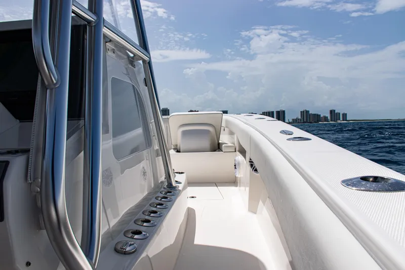  Yacht Photos Pics 2025 SeaVee 400Z boat on open water with city skyline in background.