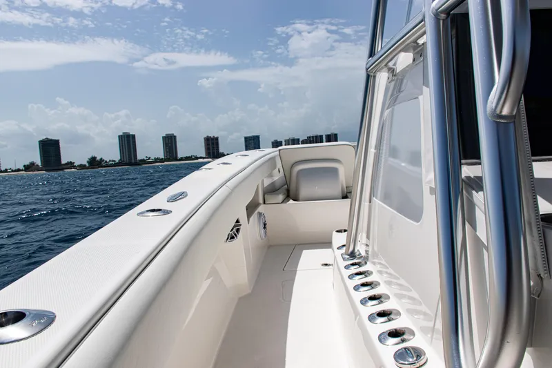  Yacht Photos Pics 2025 SeaVee 400Z boat on water with city skyline in background.