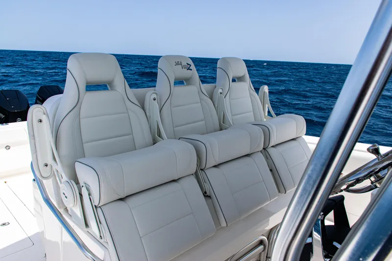  Yacht Photos Pics 2025 SeaVee 400Z boat with luxurious white seating on open ocean.