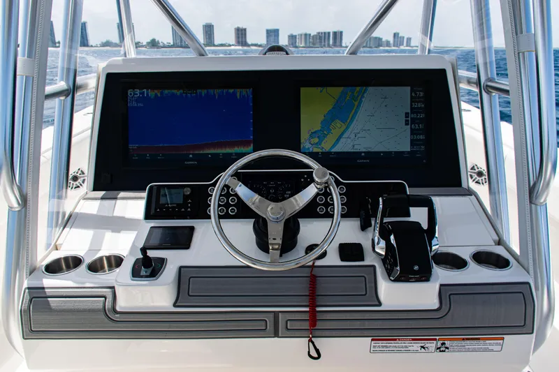  Yacht Photos Pics 2025 SeaVee 400Z boat dashboard with navigation screens and steering wheel.