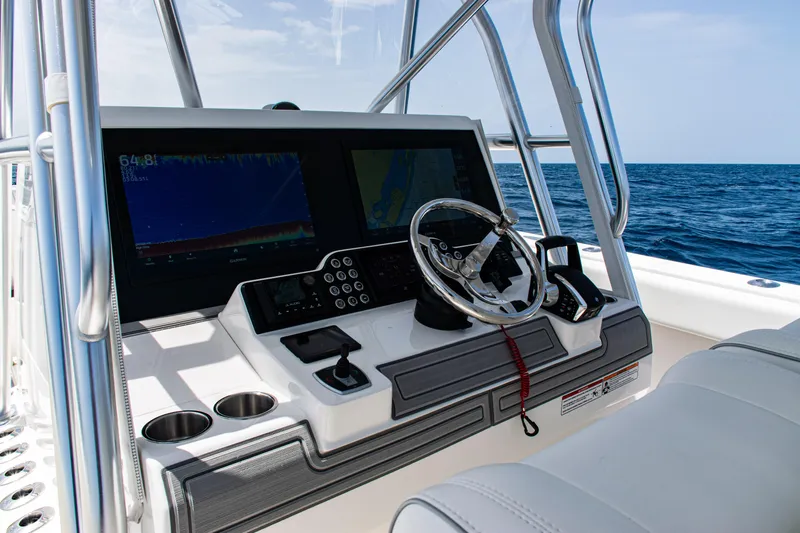  Yacht Photos Pics 2025 SeaVee 400Z boat dashboard with steering wheel and navigation screens.