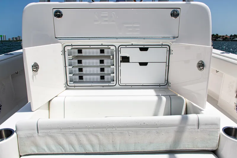  Yacht Photos Pics 2025 SeaVee 400Z boat storage compartments with open doors, showcasing organized interior.