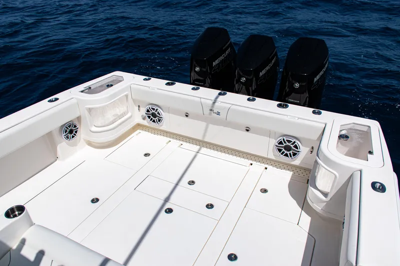  Yacht Photos Pics 2025 SeaVee 400Z boat deck with triple outboard motors on open water.