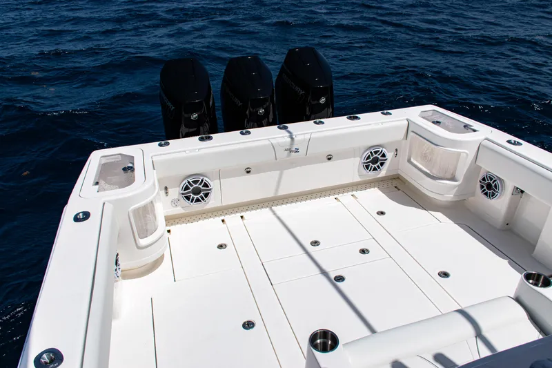  Yacht Photos Pics 2025 SeaVee 400Z boat deck with triple outboard motors on open ocean.