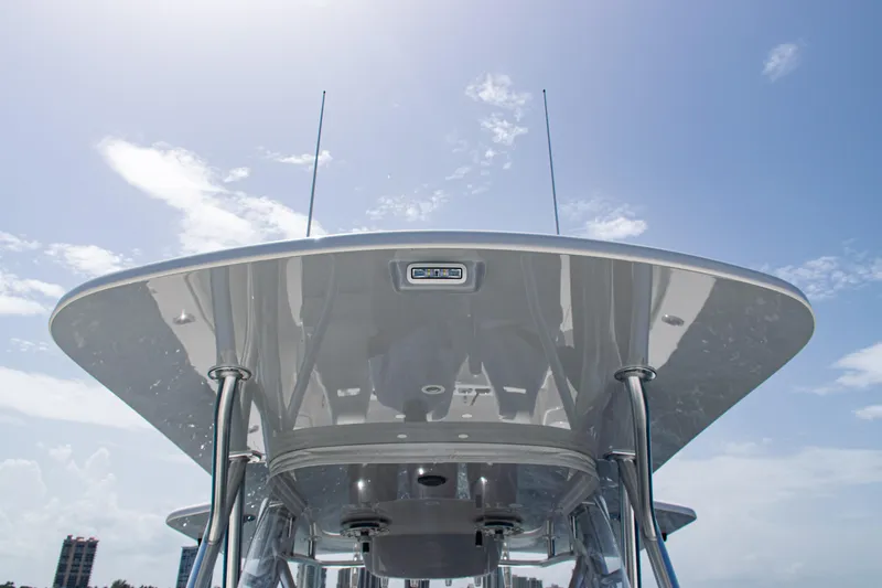  Yacht Photos Pics 2025 SeaVee 400Z boat, view of sleek canopy and antennas against blue sky.