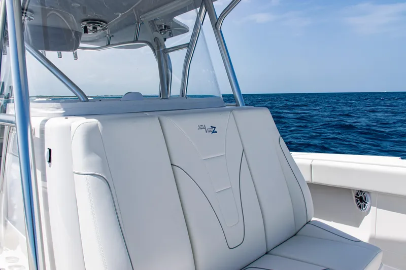  Yacht Photos Pics 2025 SeaVee 400Z boat interior with white seating, ocean view, and clear sky.