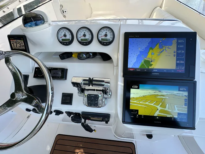 Yacht Photos Pics 2005 Intrepid 348 WA boat dashboard with navigation screens and gauges.