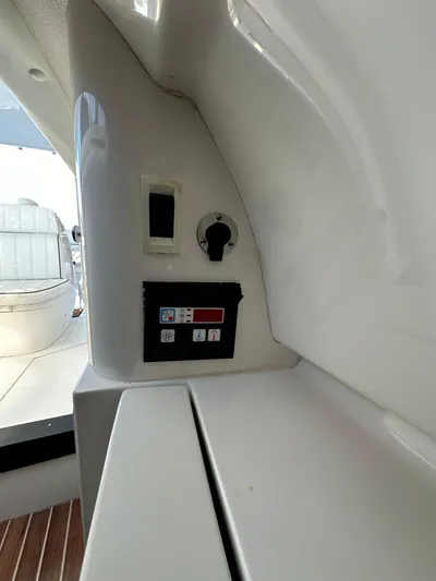  Yacht Photos Pics Control panel inside 2005 Intrepid 348 WA boat, featuring switches and gauges.