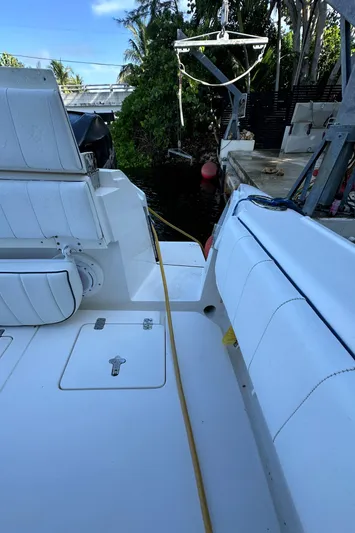  Yacht Photos Pics 2005 Intrepid 348 WA boat docked, featuring white seating and deck.