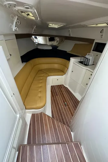  Yacht Photos Pics Interior of 2005 Intrepid 348 WA boat with tan seating and wood flooring.