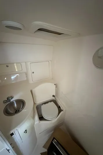  Yacht Photos Pics 2005 Intrepid 348 WA boat bathroom with sink and toilet.