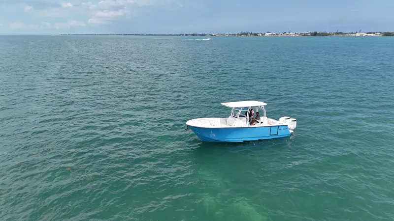  Yacht Photos Pics 2024 Sea Born SX281 Offshore LE boat cruising on open water.