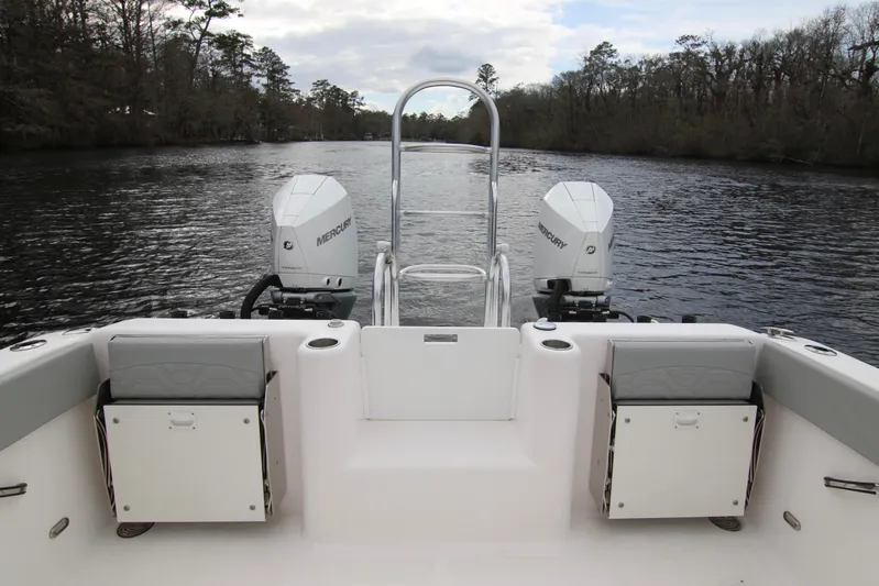  Yacht Photos Pics 2024 Twin Vee 280 GFX CC boat with dual Mercury engines on a scenic river.