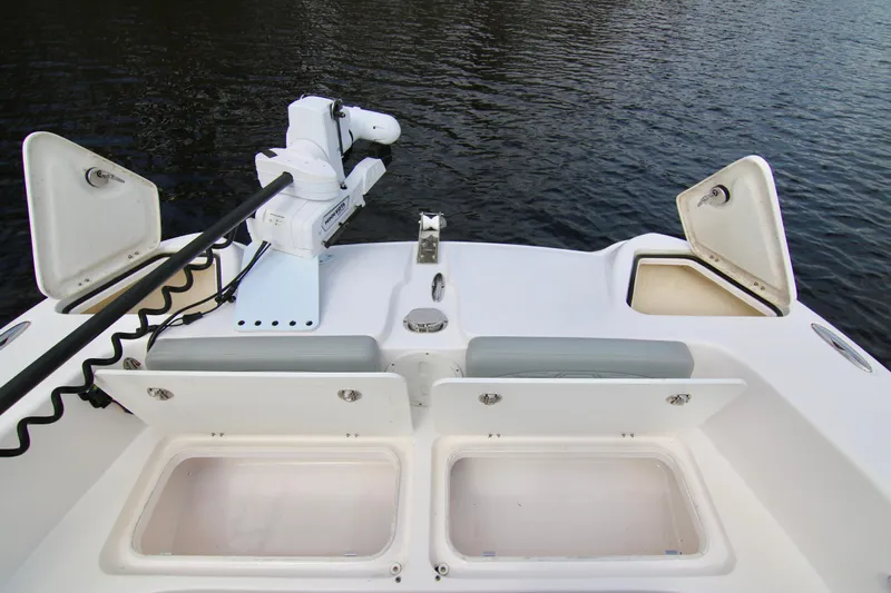  Yacht Photos Pics 2024 Twin Vee 280 GFX CC boat deck with storage compartments and trolling motor.