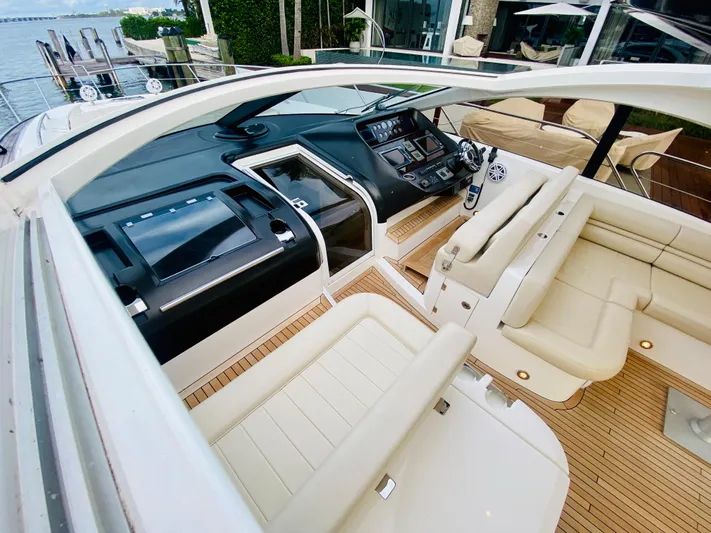 Essence Yacht Photos Pics Sunseeker Predator 60 2010 yacht cockpit with luxurious seating and advanced navigation controls.