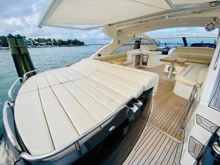 Essence Yacht Photos Pics 2010 Sunseeker Predator 60 yacht with spacious deck and luxurious seating.