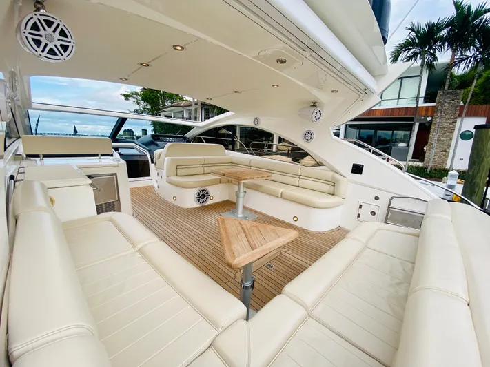 Essence Yacht Photos Pics Luxurious 2010 Sunseeker Predator 60 yacht with spacious seating and modern amenities.