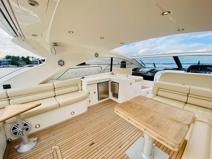 Essence Yacht Photos Pics Luxurious 2010 Sunseeker Predator 60 yacht interior with spacious seating and wooden table.