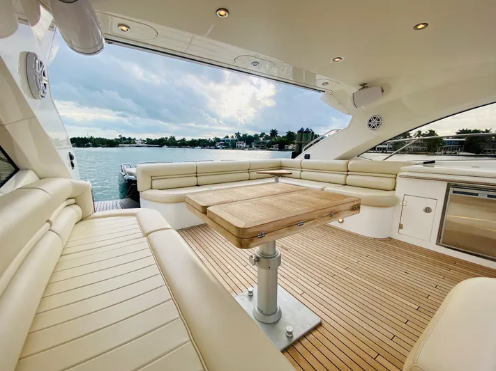 Essence Yacht Photos Pics Luxurious 2010 Sunseeker Predator 60 yacht with spacious seating and scenic water view.