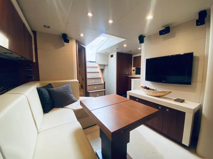 Essence Yacht Photos Pics Luxurious interior of 2010 Sunseeker Predator 60 yacht with modern furnishings and entertainment system.