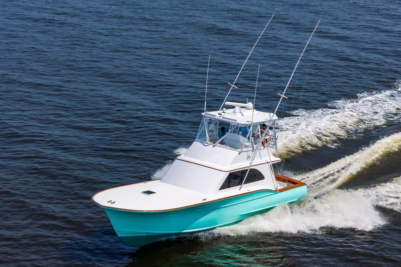 Sea Horse Yacht Photos Pics 1994 Custom Carolina 43 Blackwell Convertible cruising on open water.