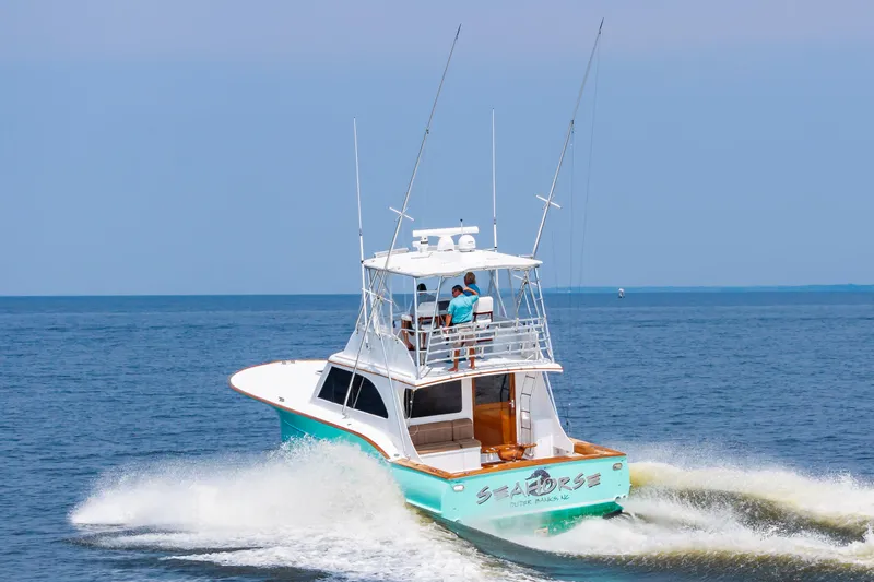 Sea Horse Yacht Photos Pics 1994 Custom Carolina 43 Blackwell Convertible yacht cruising on open water.