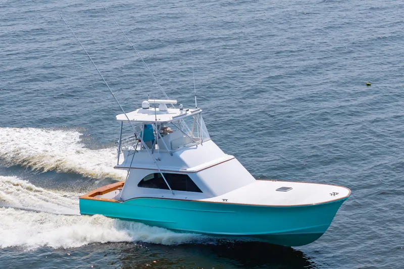 Sea Horse Yacht Photos Pics 1994 Custom Carolina 43 Blackwell Convertible yacht cruising on open water.