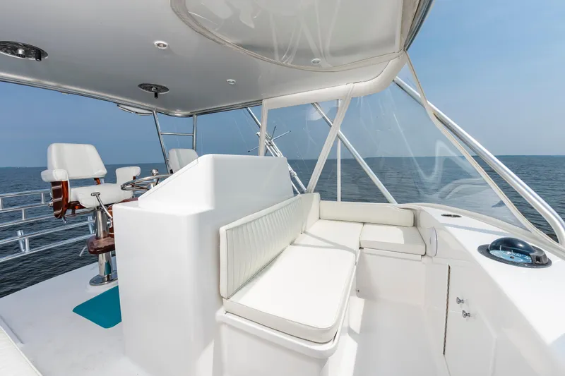 Sea Horse Yacht Photos Pics 1994 Custom Carolina 43 Blackwell Convertible yacht interior with white seating and ocean view.