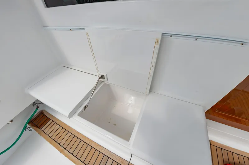 Sea Horse Yacht Photos Pics Open storage compartment on 1994 Custom Carolina 43 Blackwell Convertible boat deck.