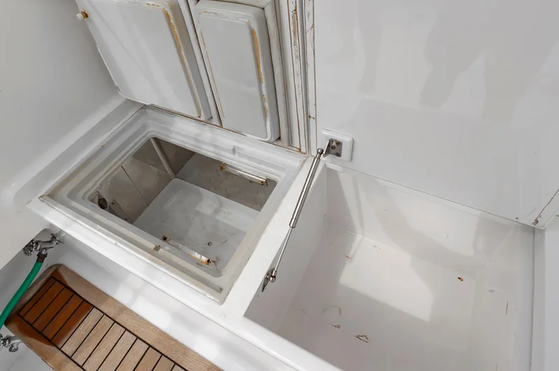 Sea Horse Yacht Photos Pics Open storage compartment on 1994 Custom Carolina 43 Blackwell Convertible boat.